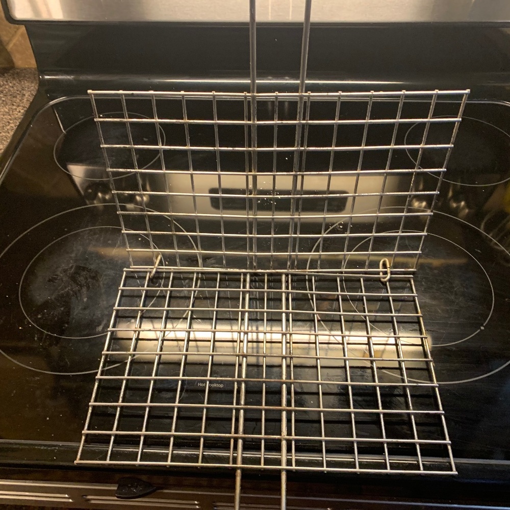 Fish cooking grill implement